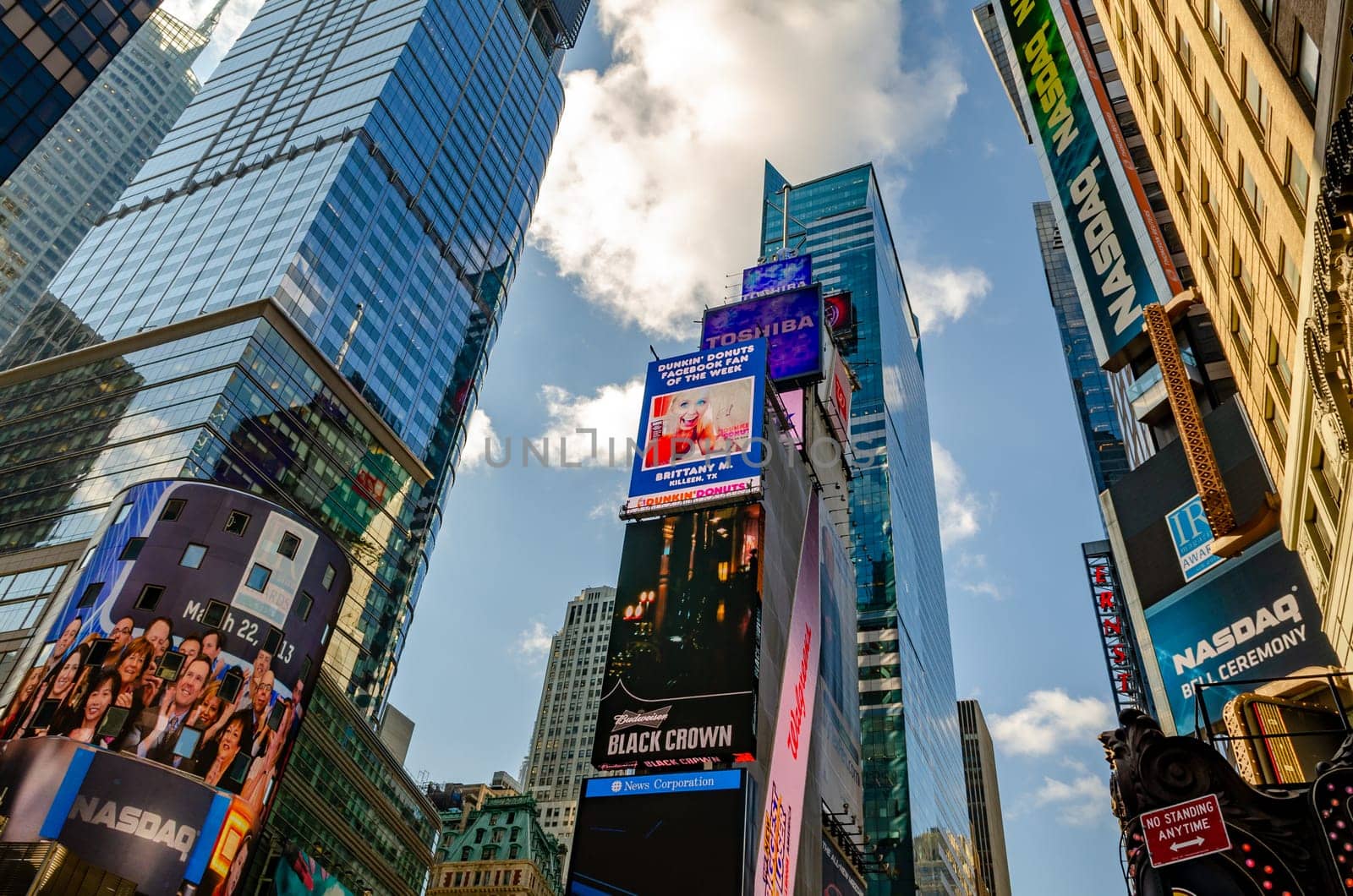 Time Square Skyscraper with advertisement scoreboards on the buildings, low angle view, horizontal