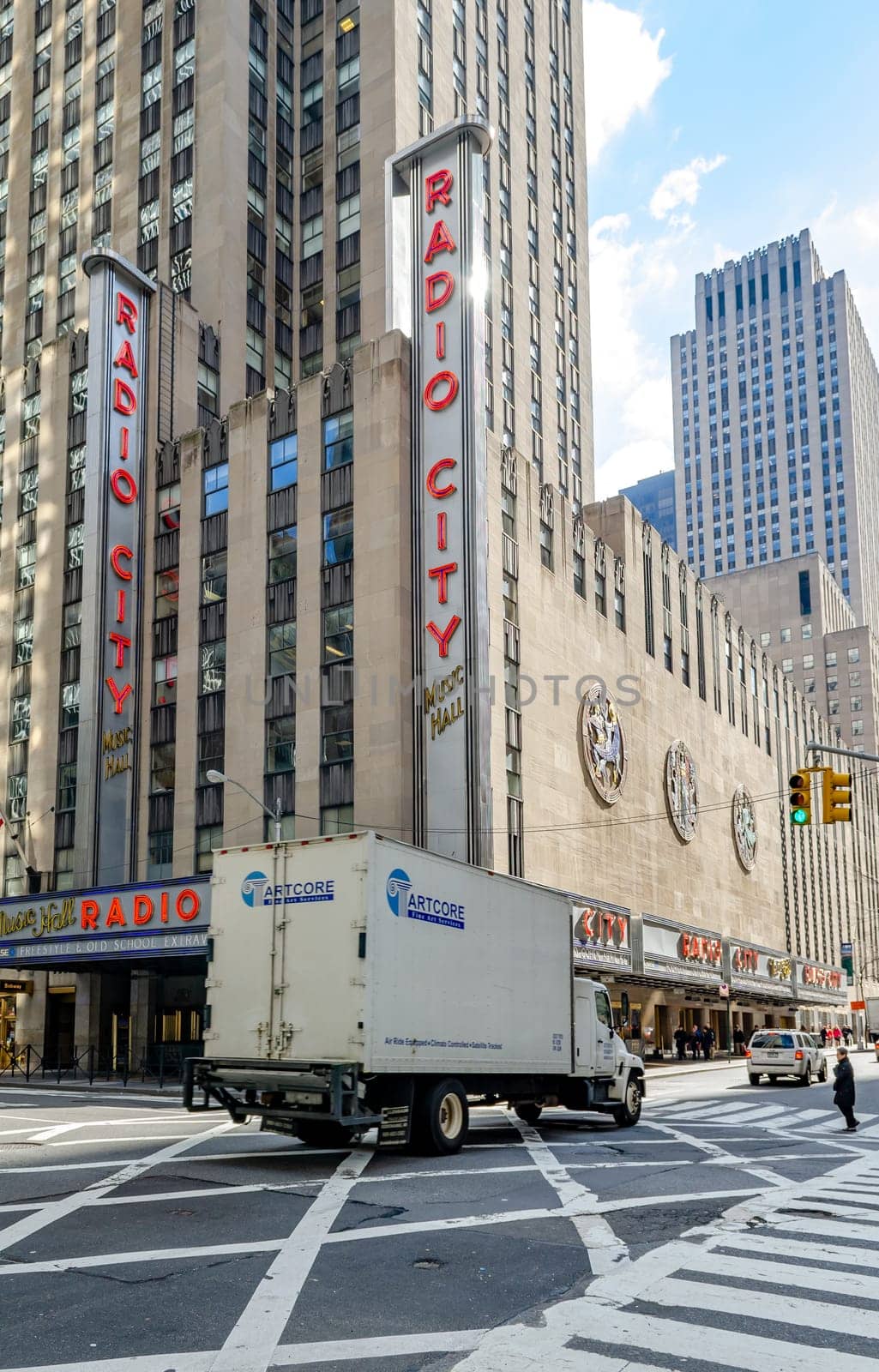 Radio City Music Hall at New York City, traffic in the forefront during daytime, vertical