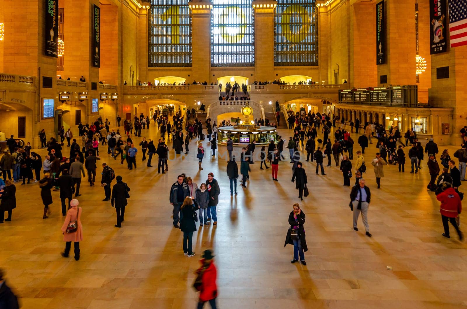 Grand Central Terminal indoors with lots of people walking around, long exposure, illuminated, horizontal