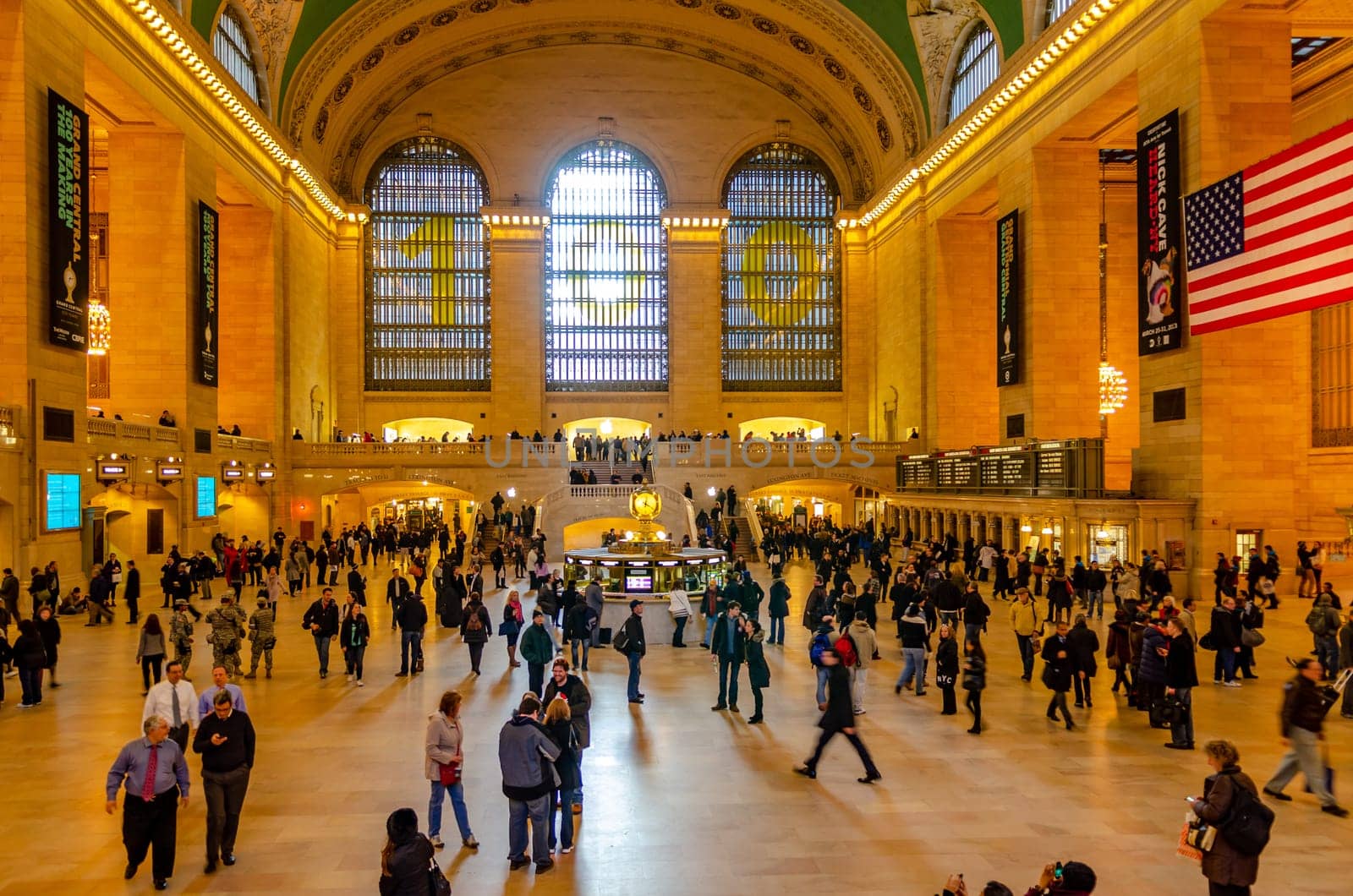 Grand Central Terminal indoors with lots of people walking around, long exposure, illuminated, horizontal