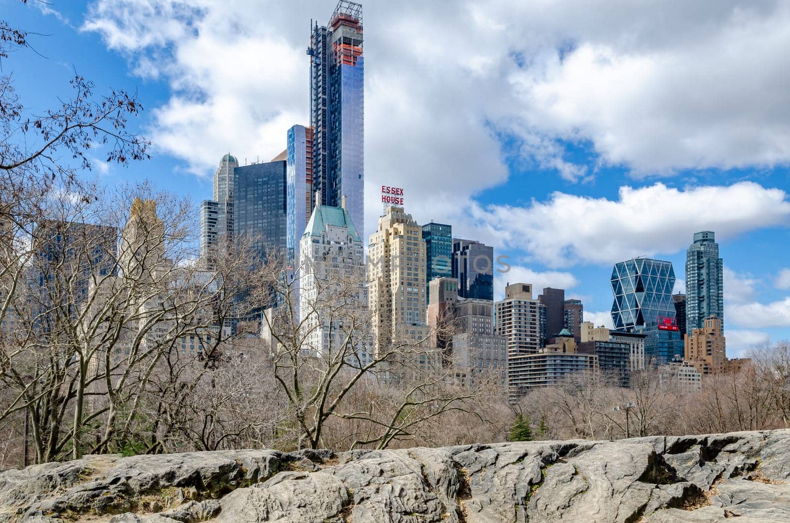 Manhattan Skyline during daytime view from Central Park New York City with rocks in the forefront, winter, horizontal