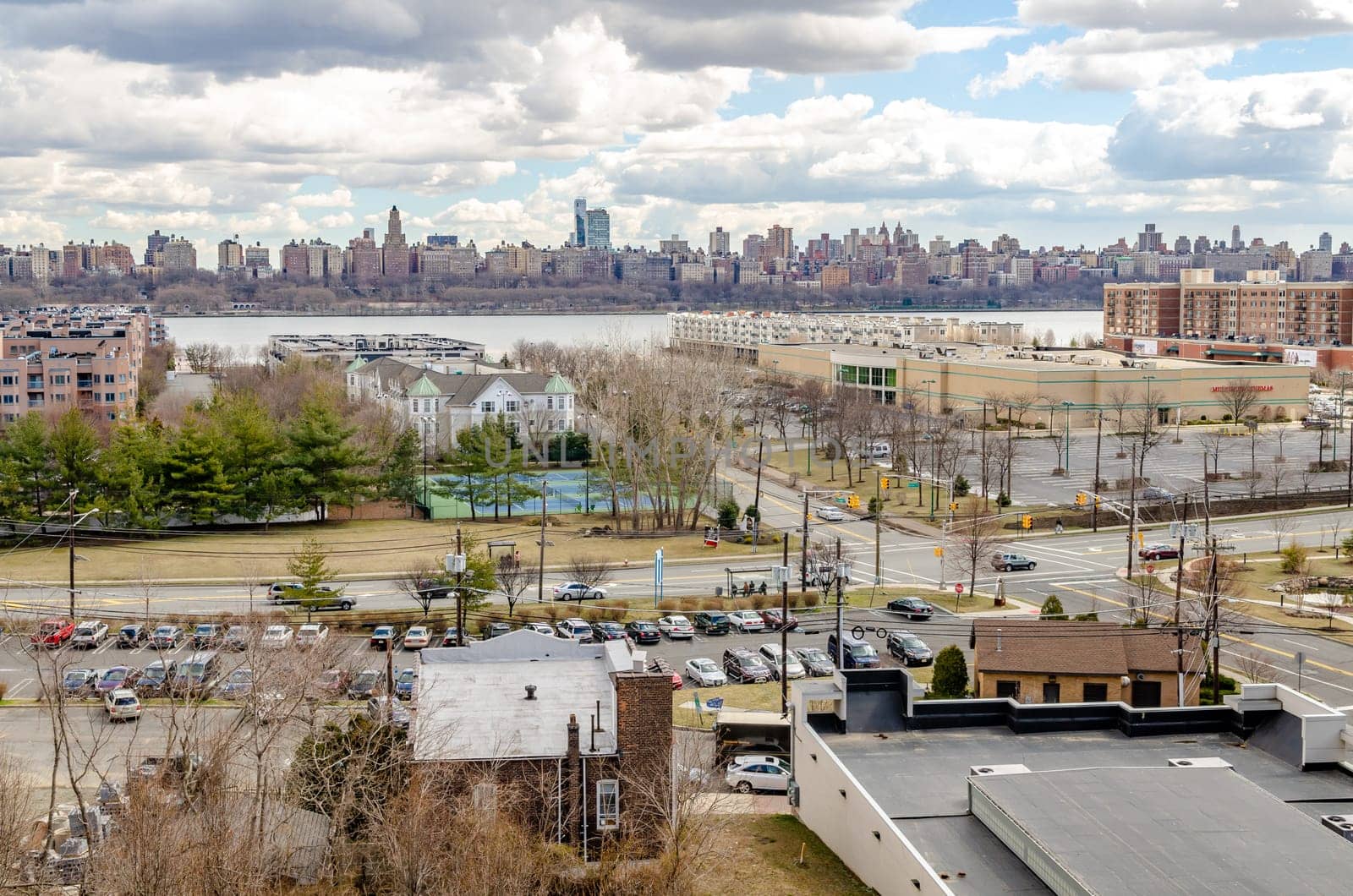 Harlem, Manhattan Skyline on the other side of Hudson river with Cliffside Park New Jersey in the front during a sunny winter day, horizontal