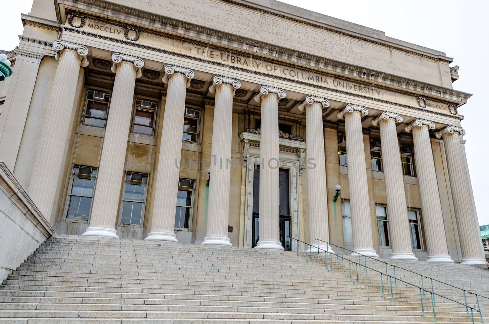 The Library of Columbia University view from low angle, no people, staircase in front of the Building, New York City, during winter day with overcast, horizontal
