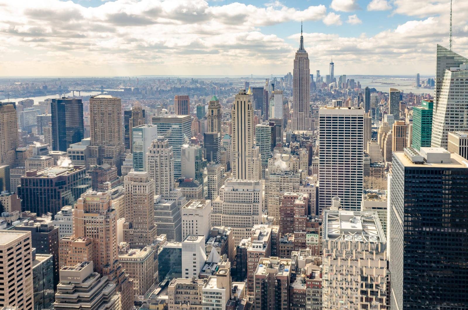 Manhattan Skyline with Empire State Building, aerial view, from Rockefeller Center, New York City during winter, horizontal