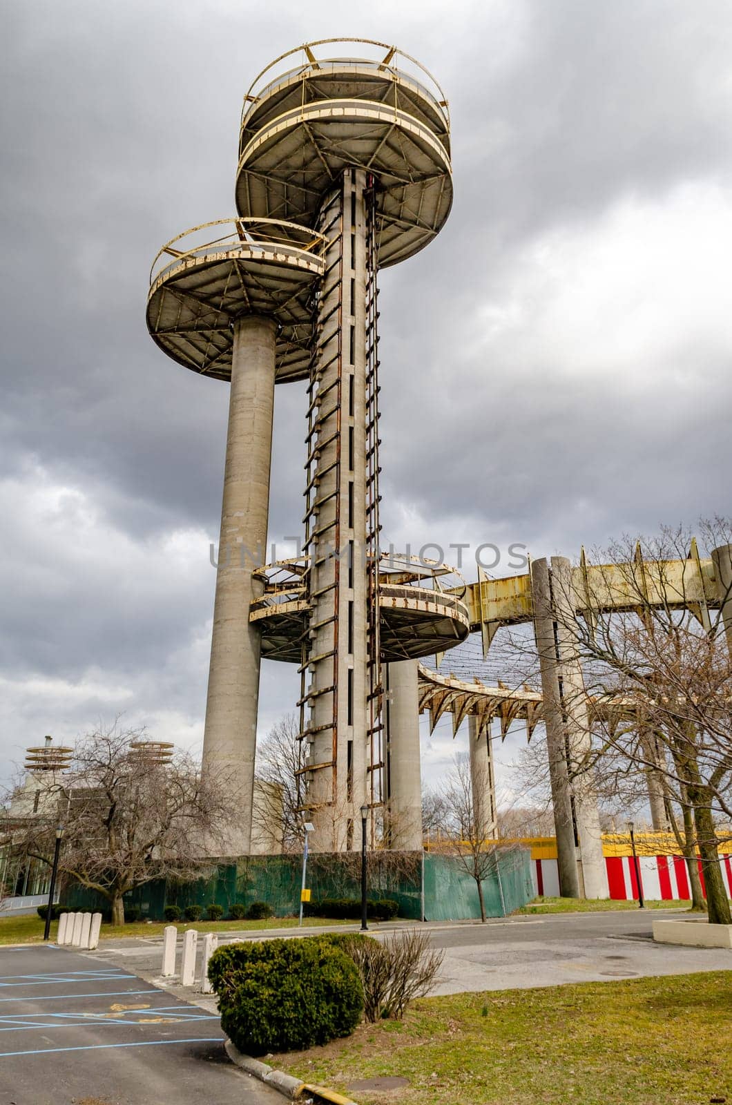 New York State Pavilion Observation Towers with Queens Theatre, view from low angle, Flushing-Meadows-Park, New York City during overcast winter day, vertical