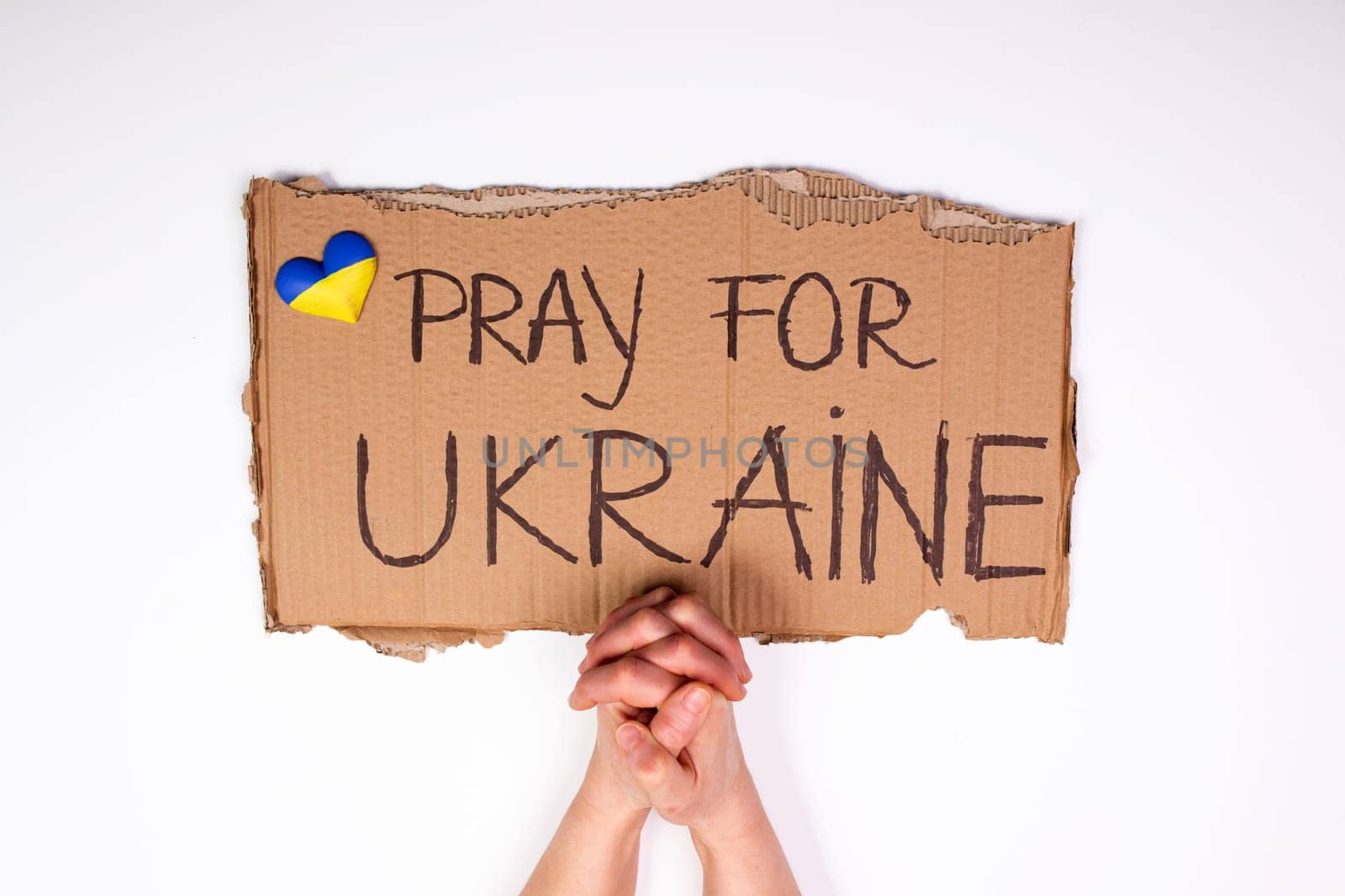 Pray for Ukraine concept background. Concept symbol of help support and no war in the country of Ukraine.