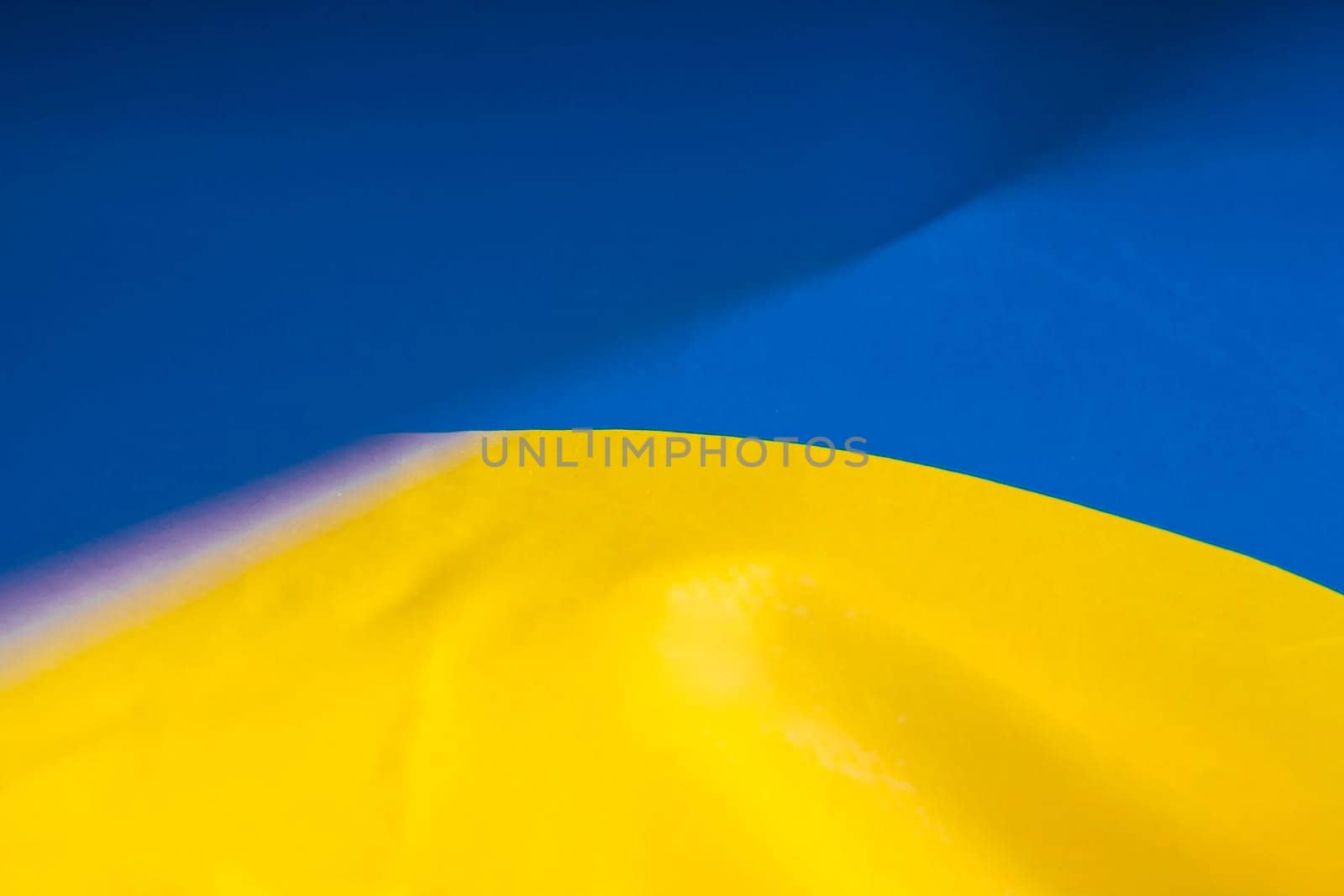 Flag of Ukraine. Blue and yellow colors. Close up shot, background