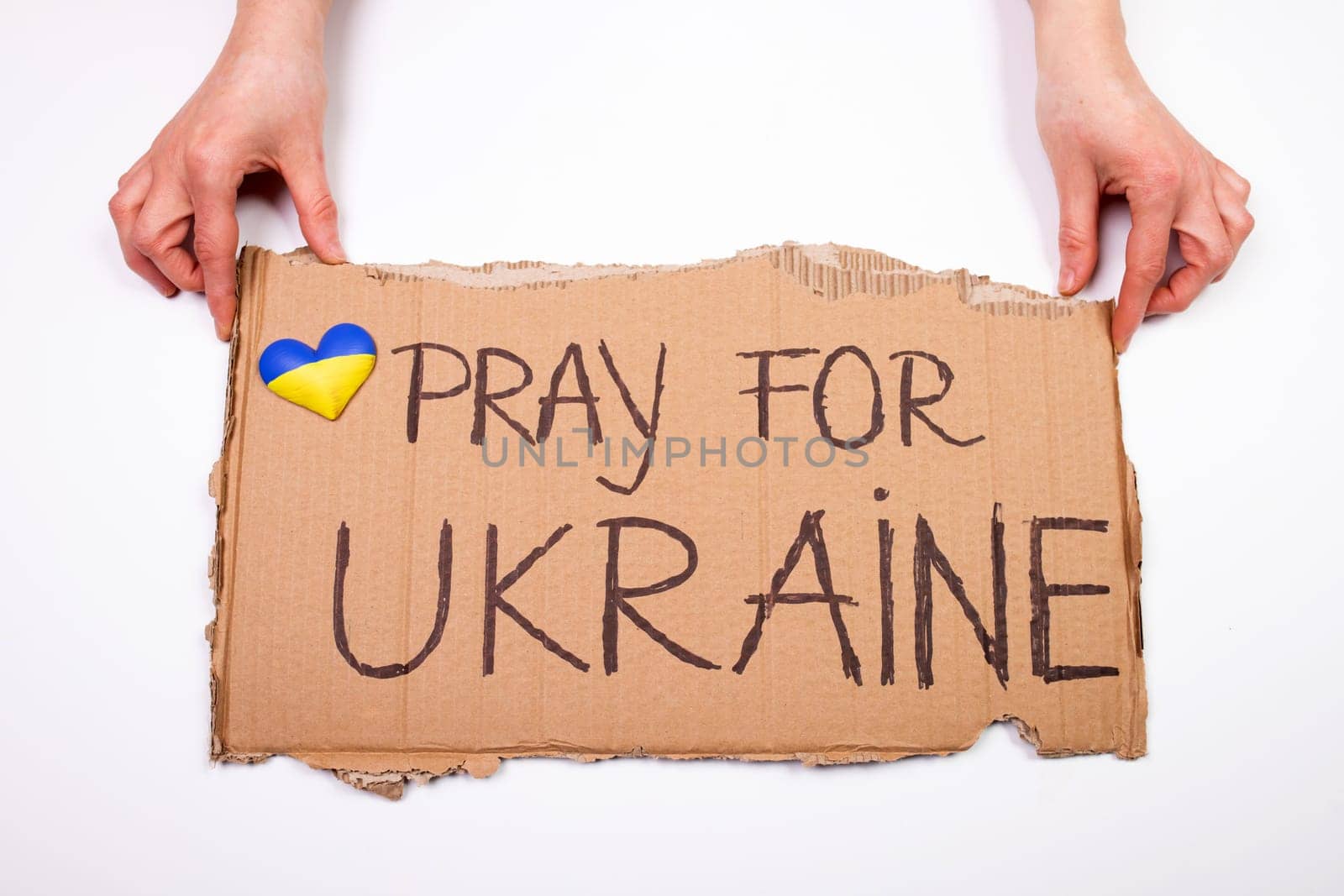 Pray for Ukraine concept background. Concept symbol of help support and no war in the country of Ukraine.