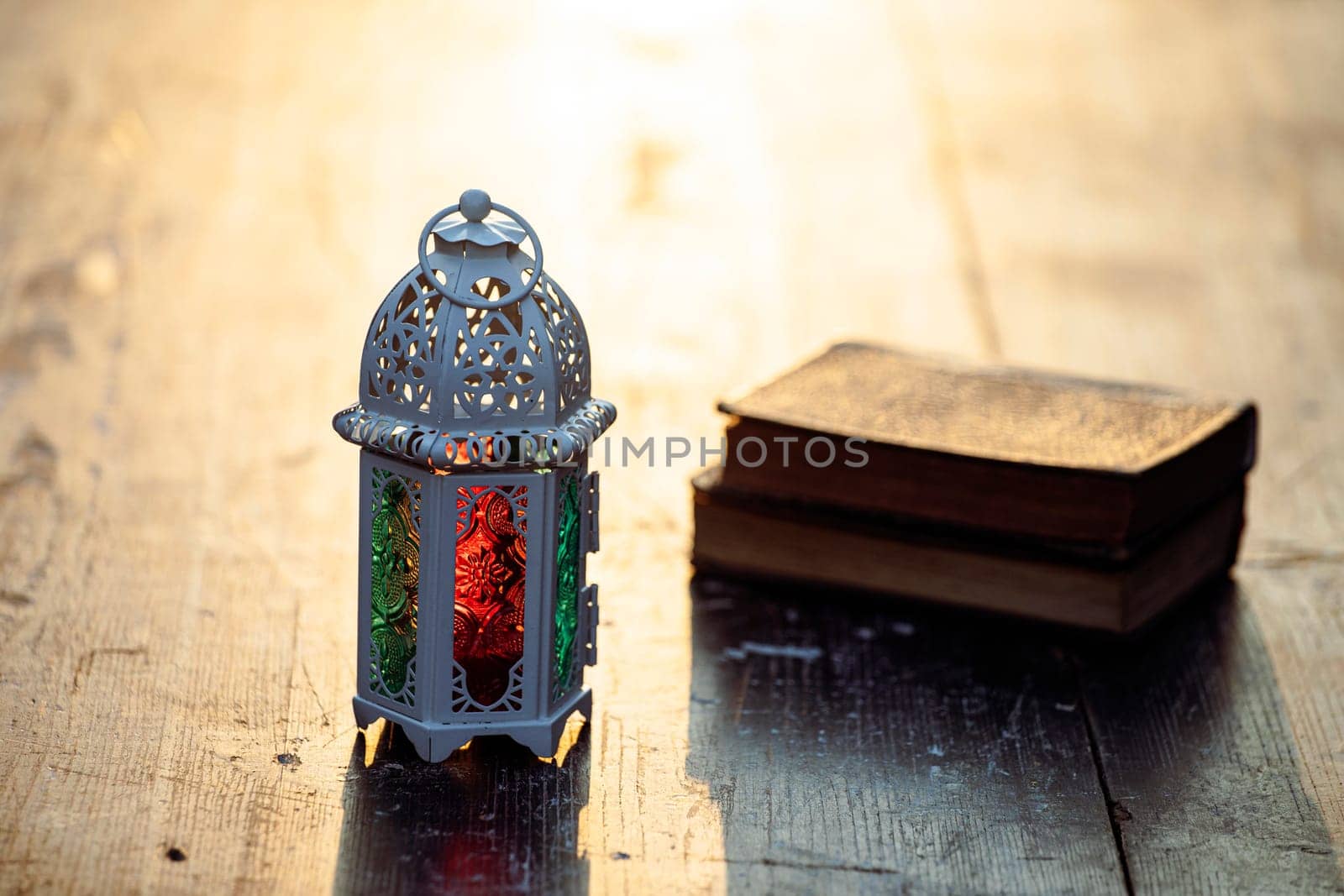 Ramadan Kareem background. Ornamental Arabic lantern glowing at night and the Quaran.