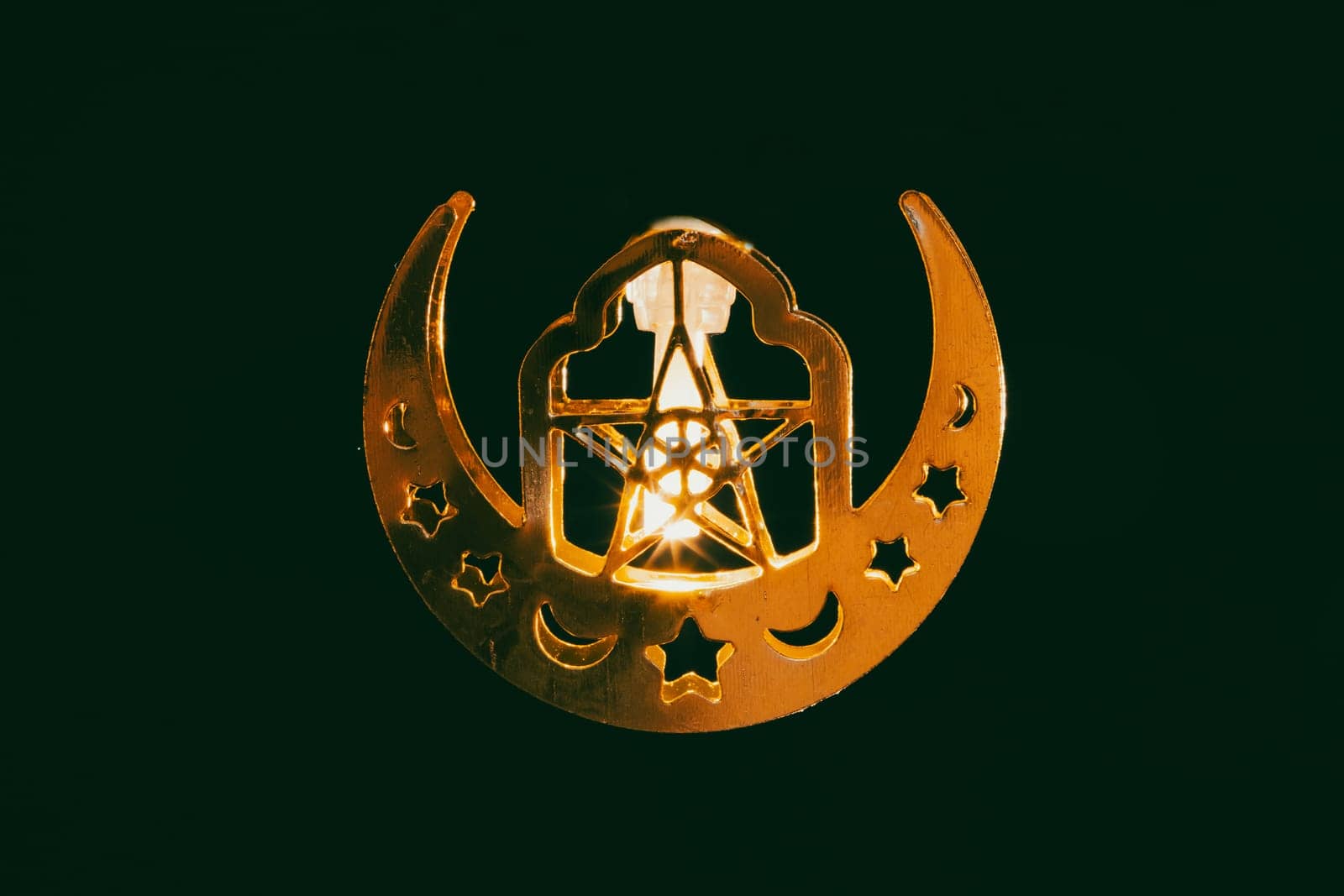 Ramadan Kareem background. Ornamental Arabic lantern glowing at night