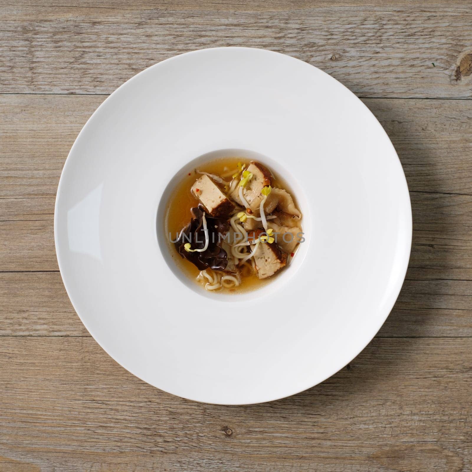 Japanese ramen sou in a plateon wooden table