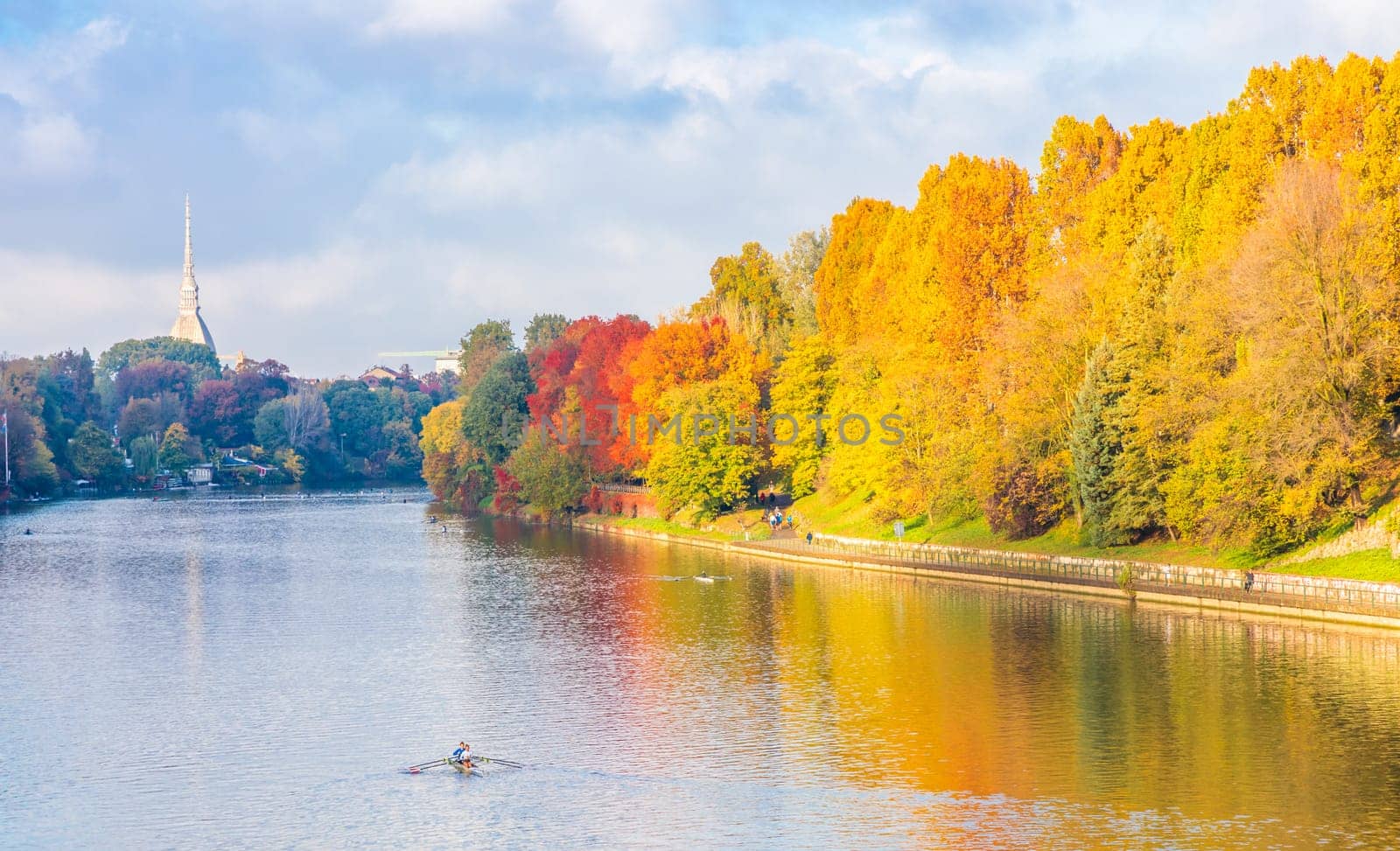 Turin, Piedmont Region, Italy - Circa November 2021: landscape in autumn with Po' river and blue sky.