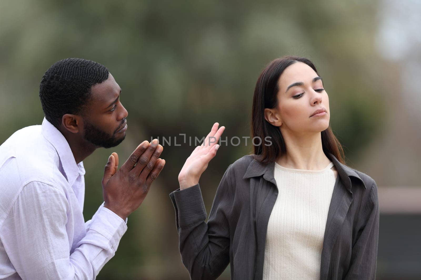 Man begging forgive and woman rejecting him