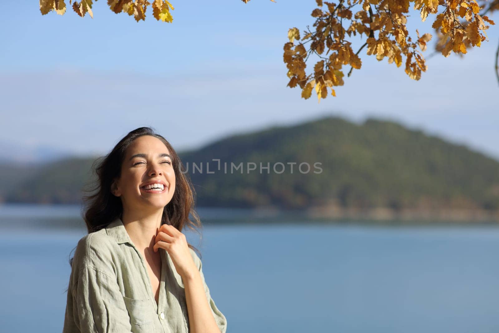 Funny woman looking up in a lake on vacation