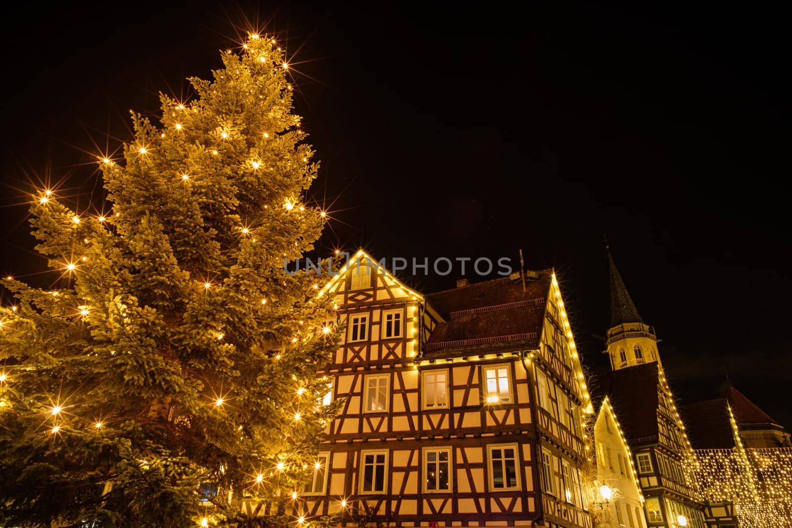 Christmas tree with half-timbered house and church in Germany