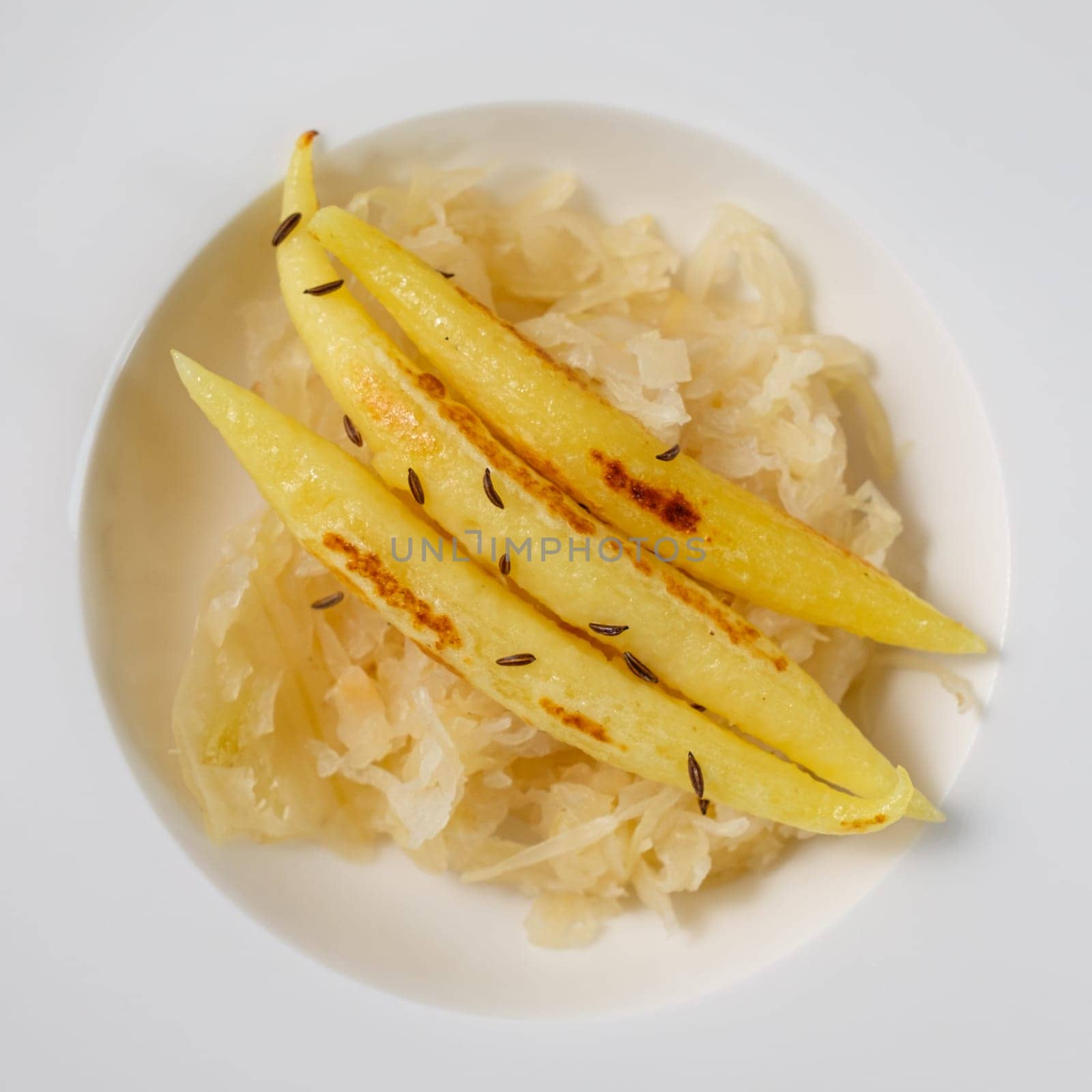 finger-shaped potato dumplings on Sauerkraut in a plate