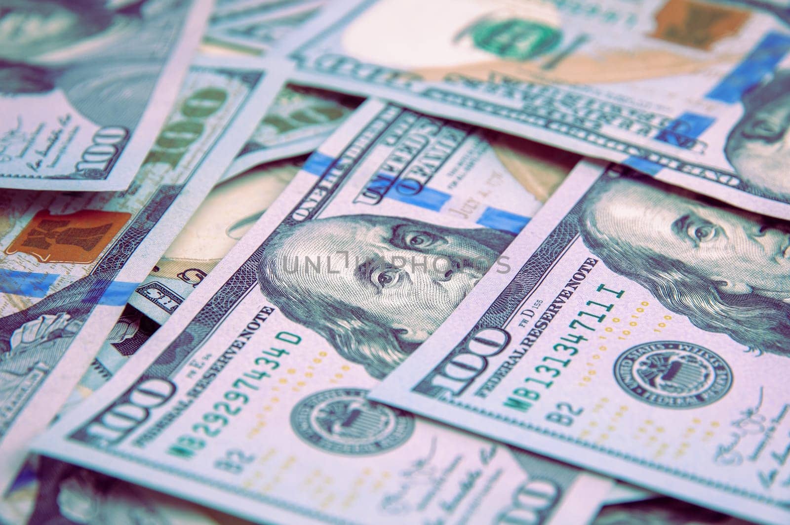 A hundred American banknotes are scattered. cash hundred-dollar bills, dollar background image.