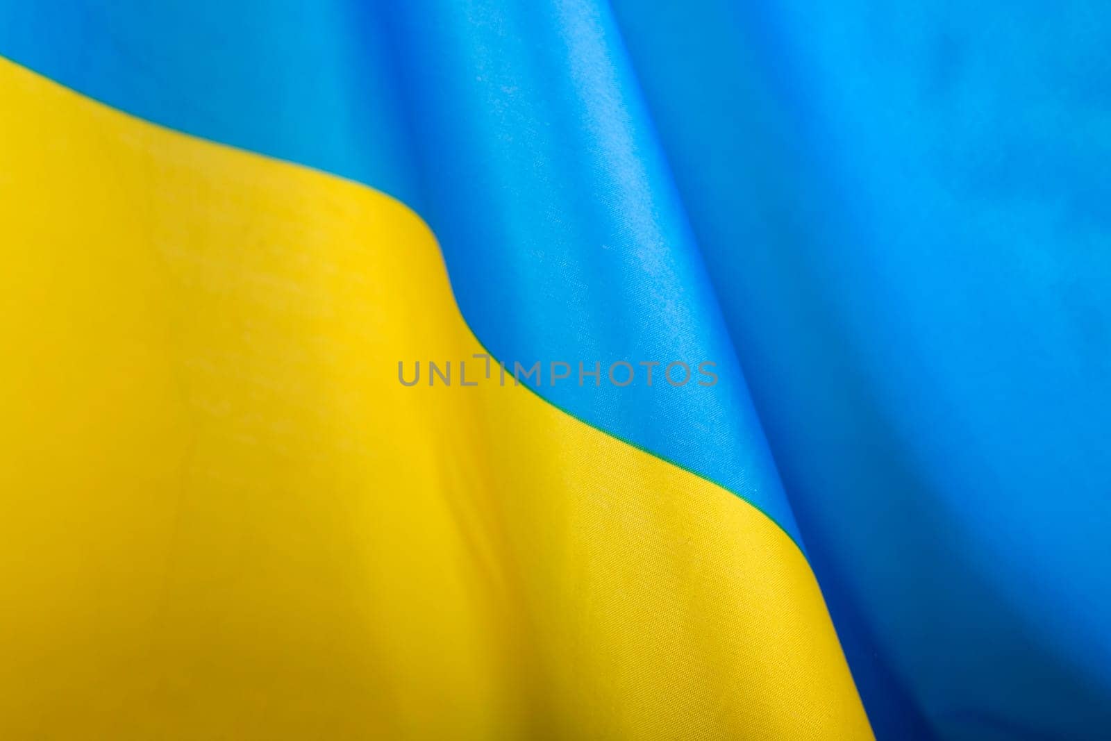Flag of Ukraine. Blue and yellow colors. Close up shot, background