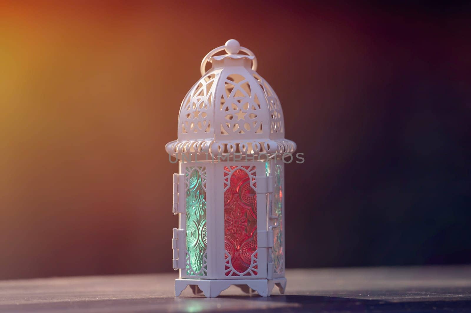 Ramadan Kareem background. Ornamental Arabic lantern glowing at night