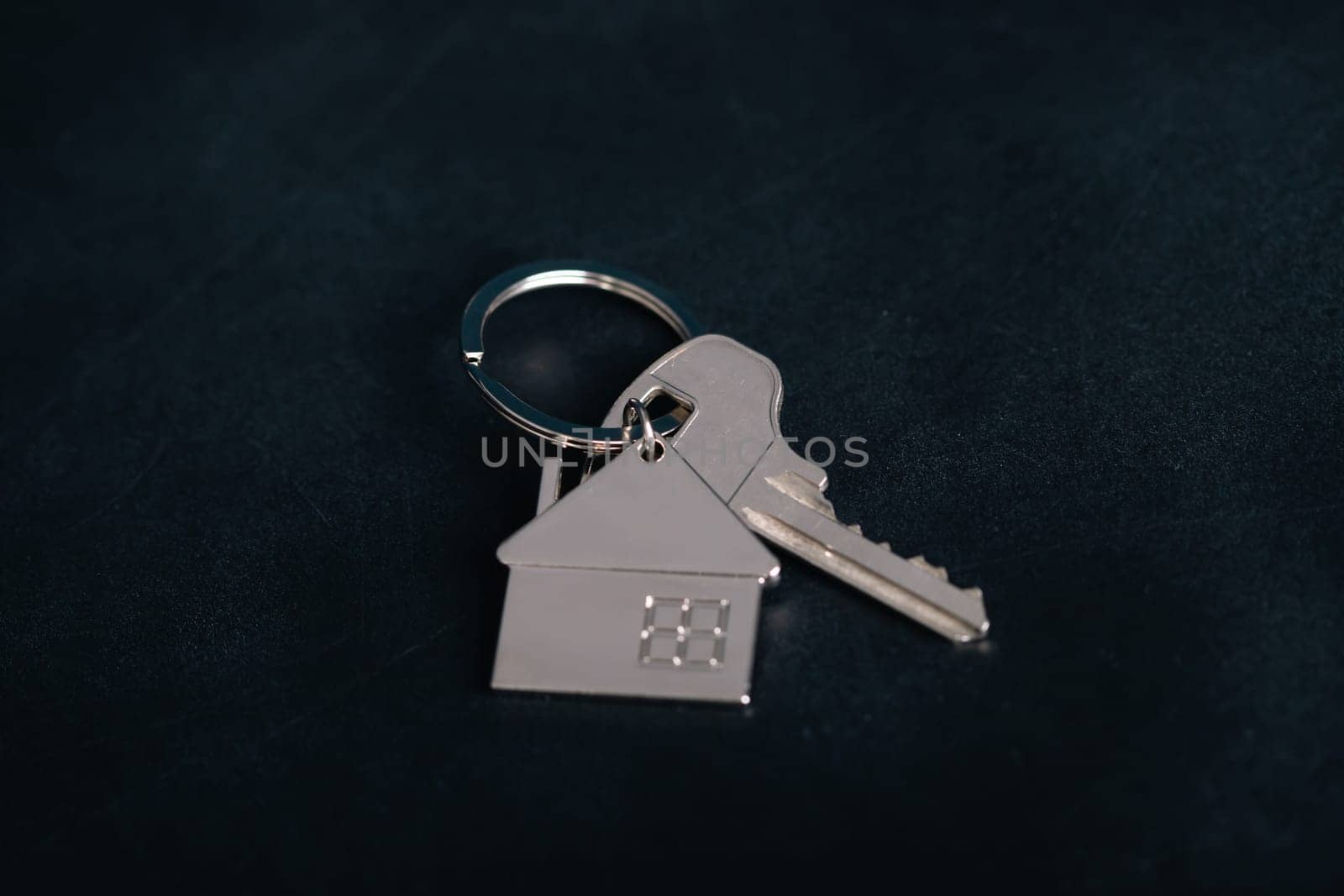 Keychain house with keys. Realtor, mortgage, your house, home loan concept. Copy space