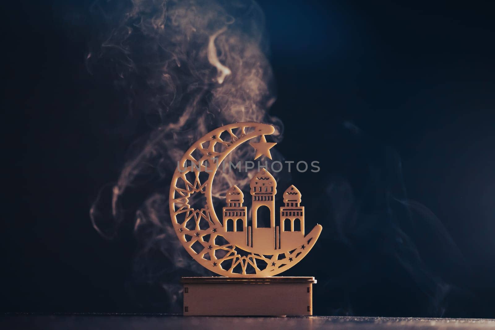 Ramadan Kareem background. Ornamental Arabic lantern glowing at night