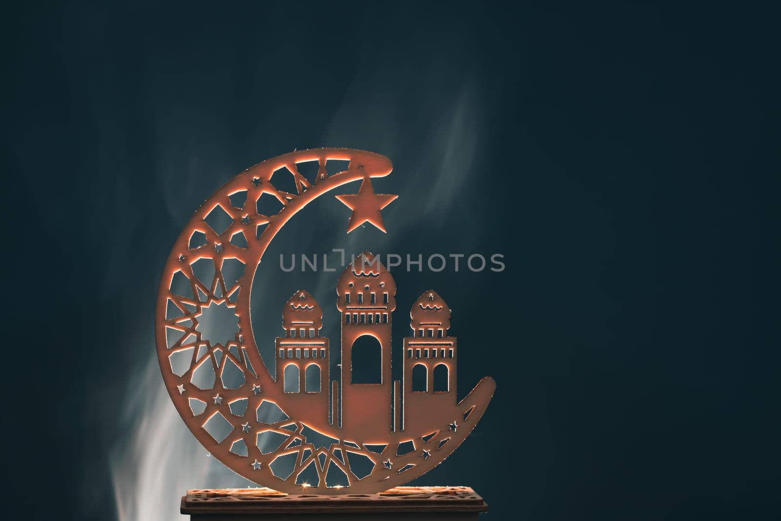 Ramadan Kareem background. Ornamental Arabic lantern glowing at night