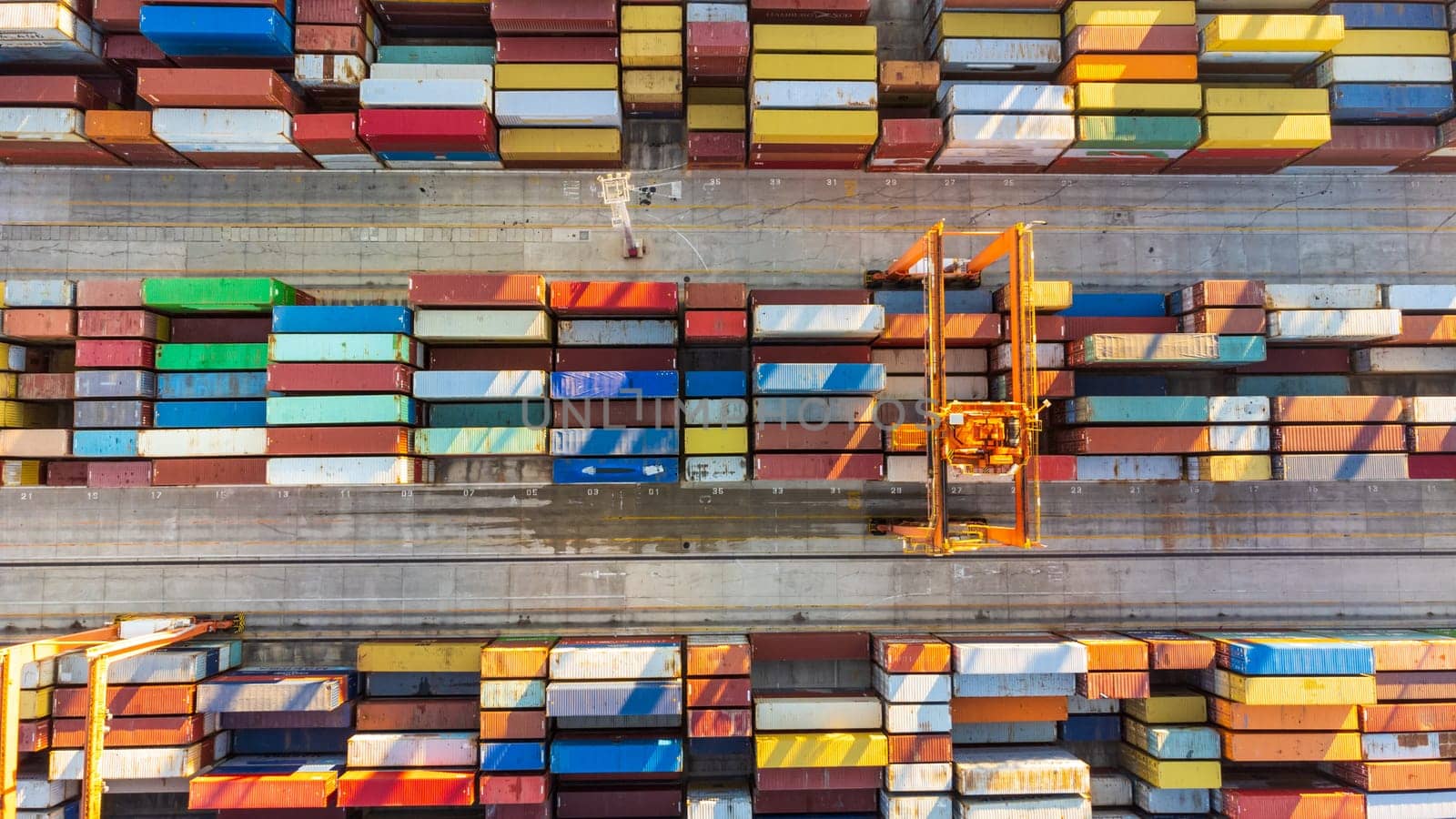 Aerial view of shipping container port terminal. Colourful pattern of containers in harbor. Maritime logistics global inport export trade transportation