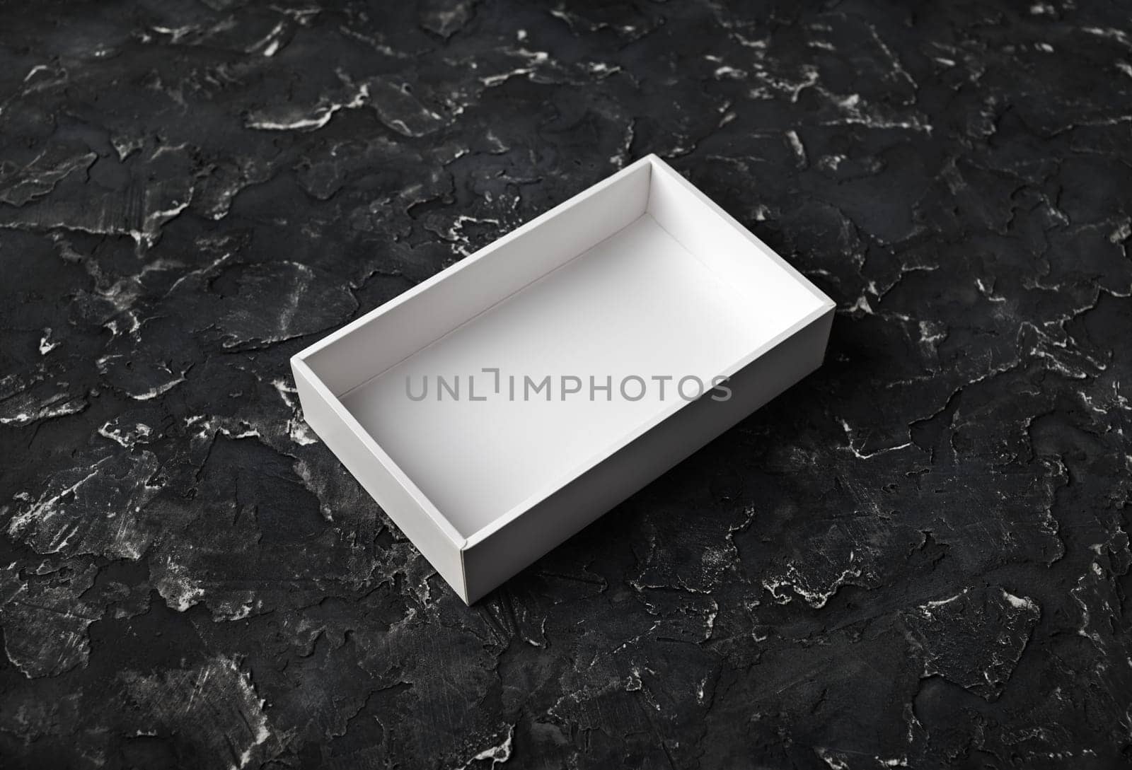 Blank box container template on black plaster background.