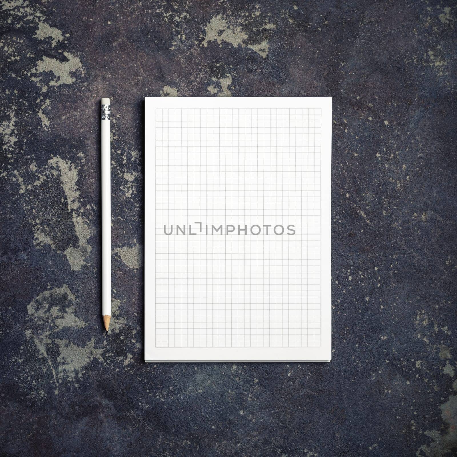 Copybook and pencil on concrete background. Branding stationery mockup. Blank objects for placing your design. Top view. Flat lay.