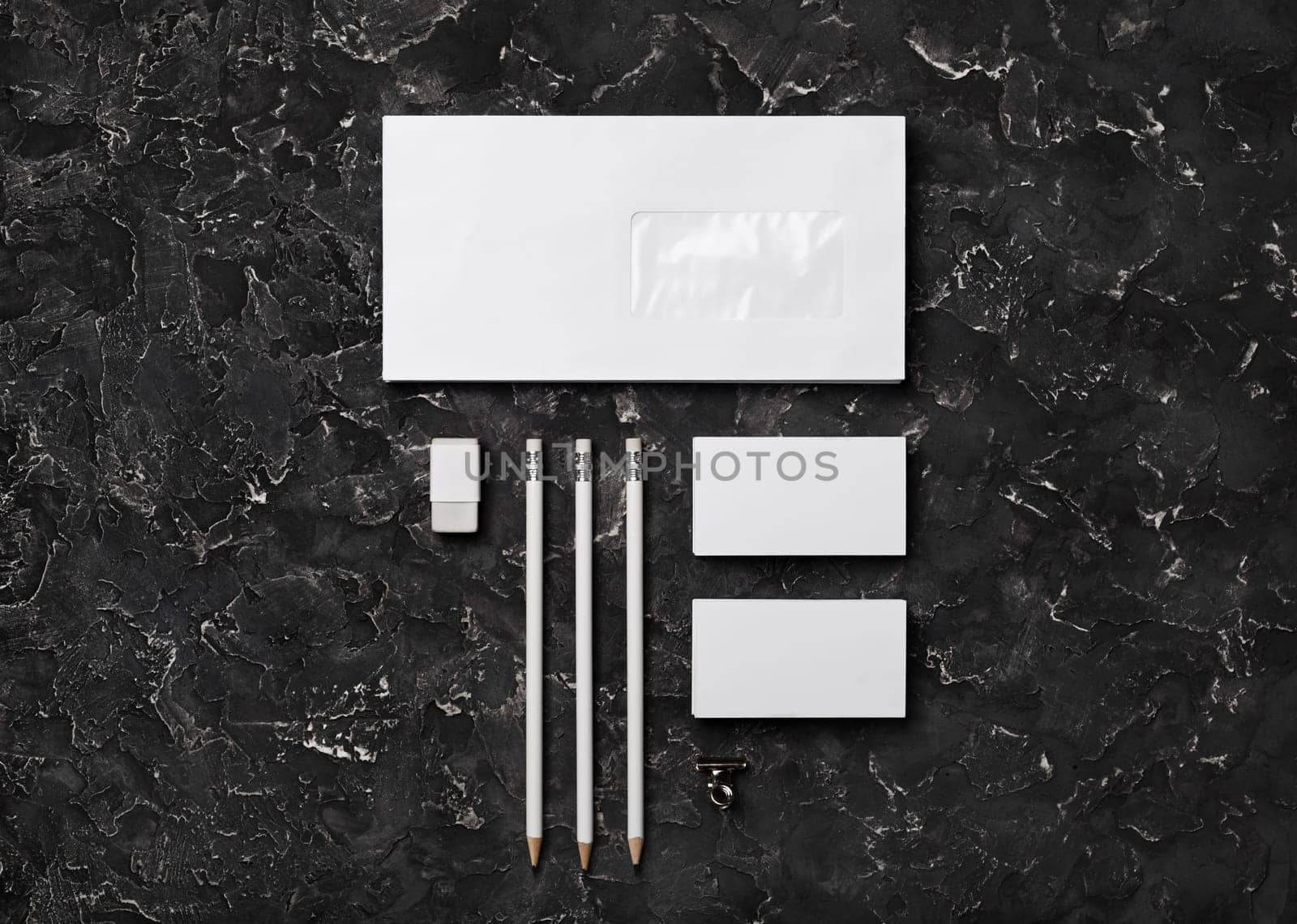 Blank stationery set on black plaster background. Template for branding identity. Top view. Flat lay.