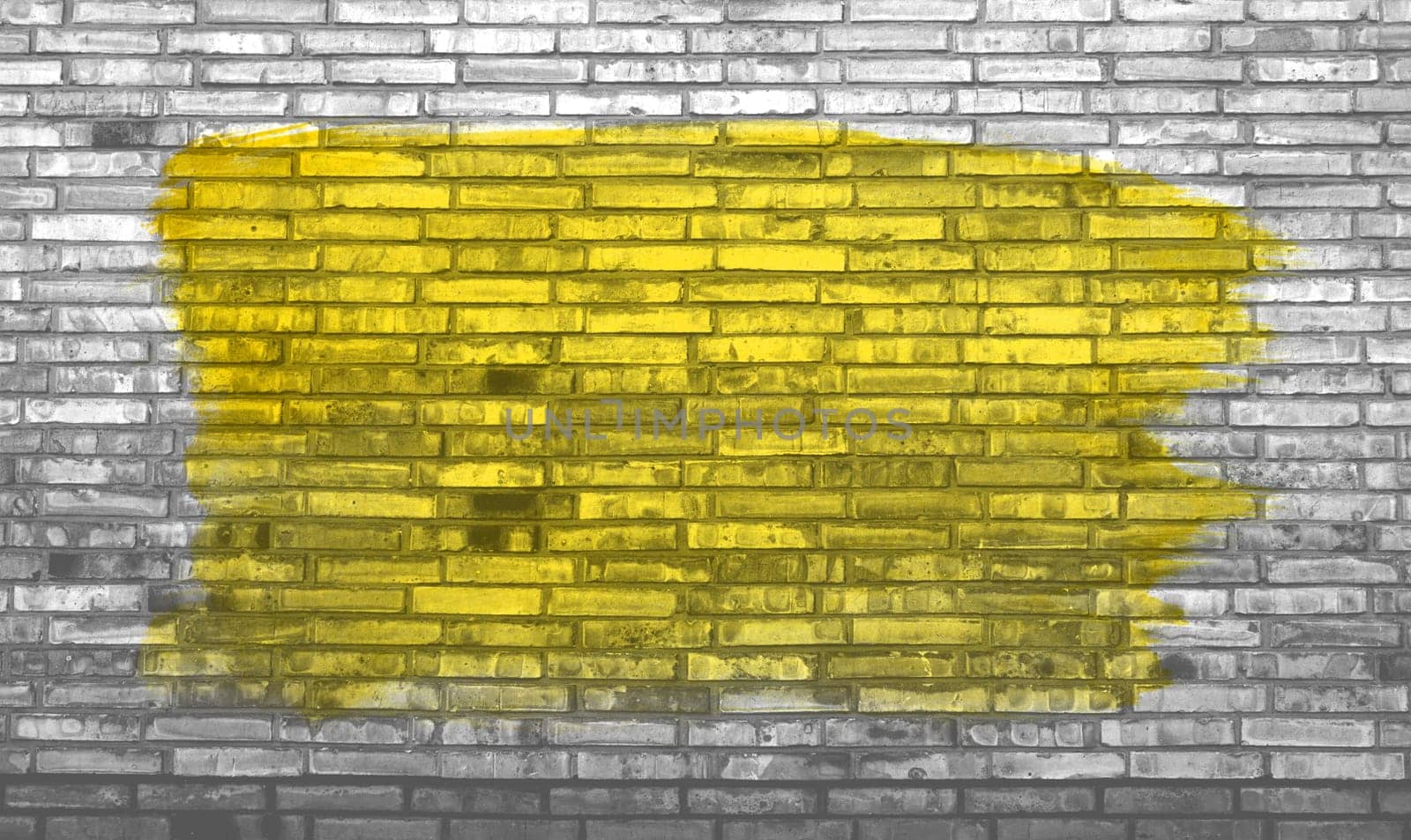 Brick wall background with yellow graffiti color