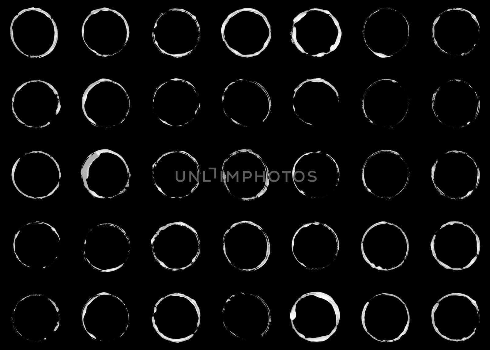 Collection of 35 hand dawn circle made with brush - white on black