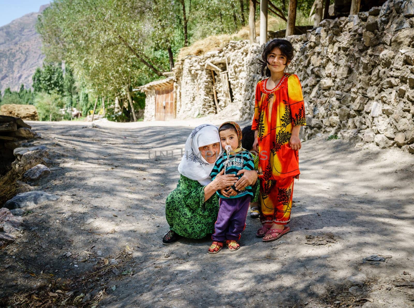 August 26, 2016, Margib village, Tajikistan: Local children with their grandmother in a small village in Yaghnob region of Tajikistan