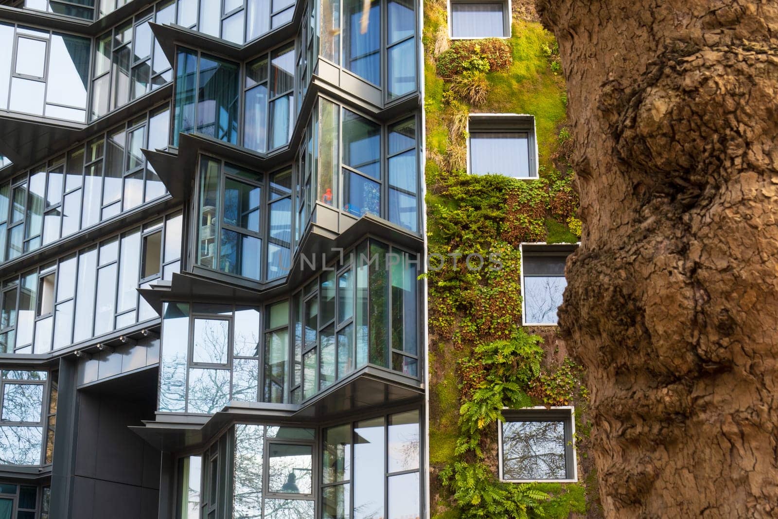 Rennes, France - march 21 2022:  Urban facade, vertical green garden in architecture. Ecological building in Rennes, France