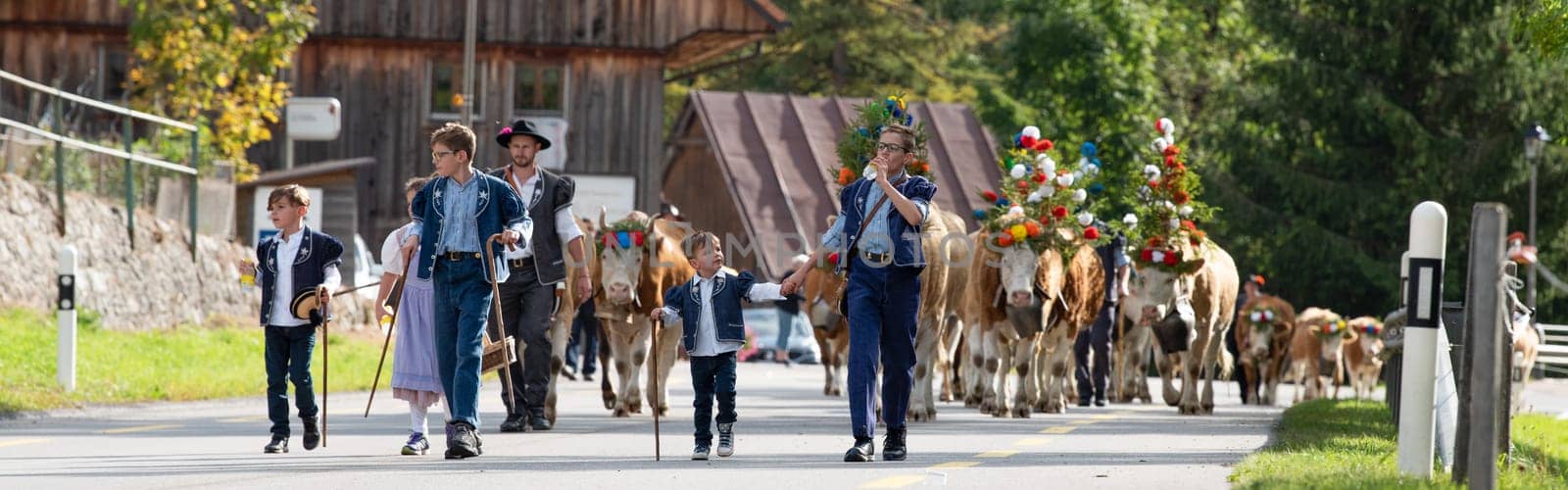 Charmey, Fribourg, Switzerland - 28 September 2019 : Farmers with a herd of cows on the annual transhumance at Charmey near Gruyeres, Fribourg zone on the Swiss alps
