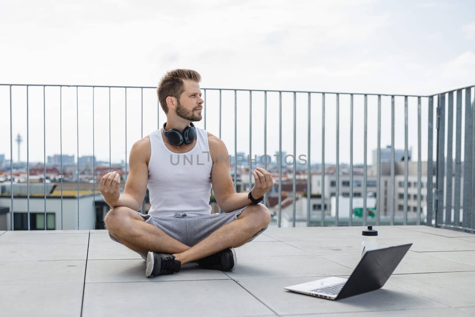 Handsome young man training and working out outdoors