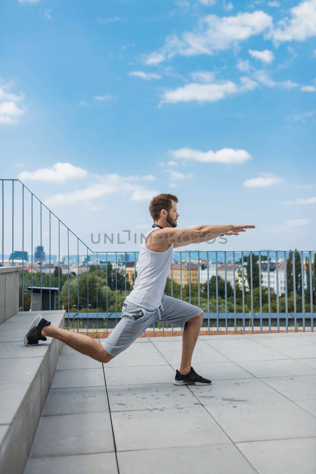 Handsome young man training and working out outdoors
