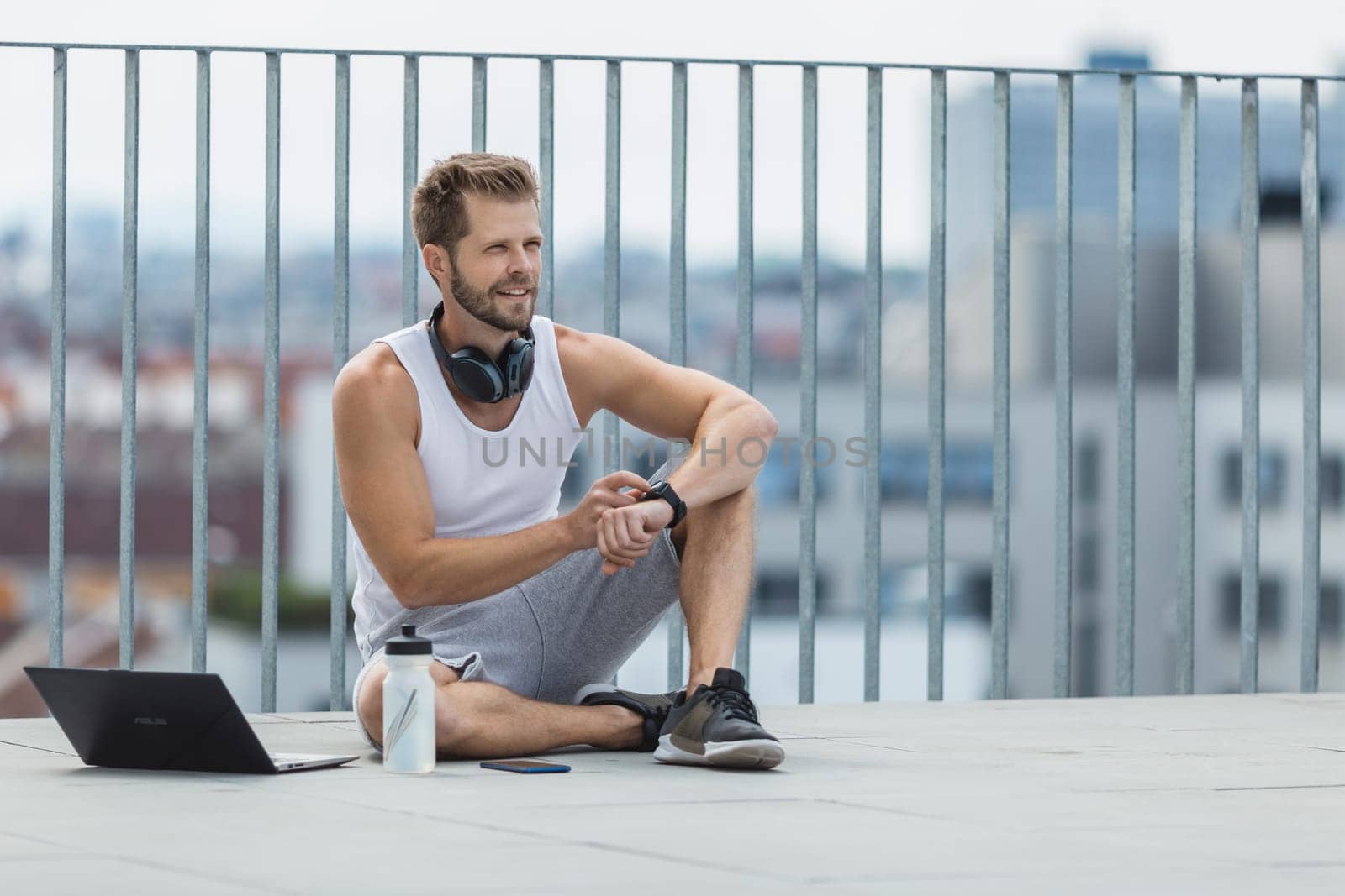 Handsome young man training and working out outdoors