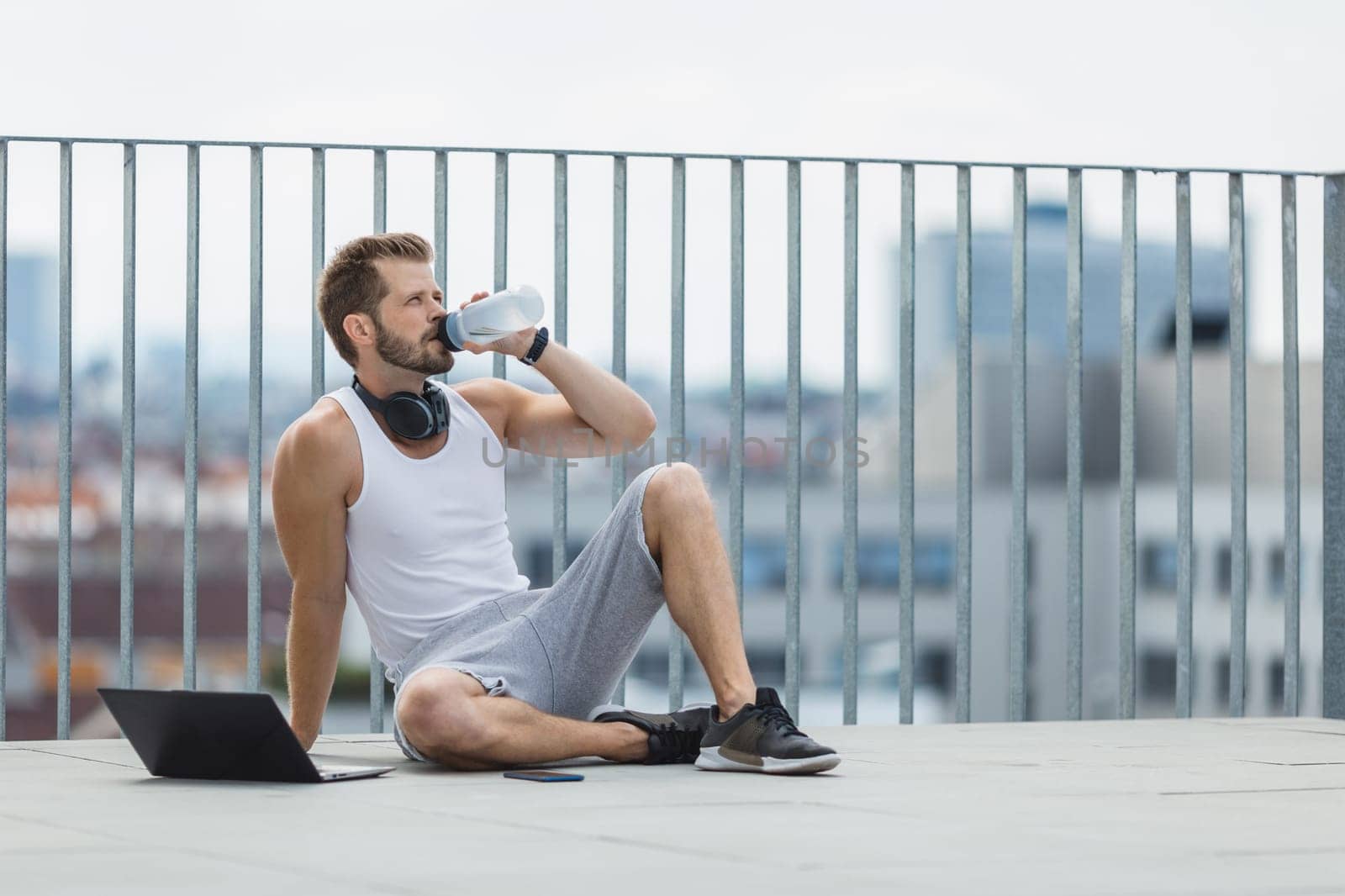 Handsome young man training and working out outdoors