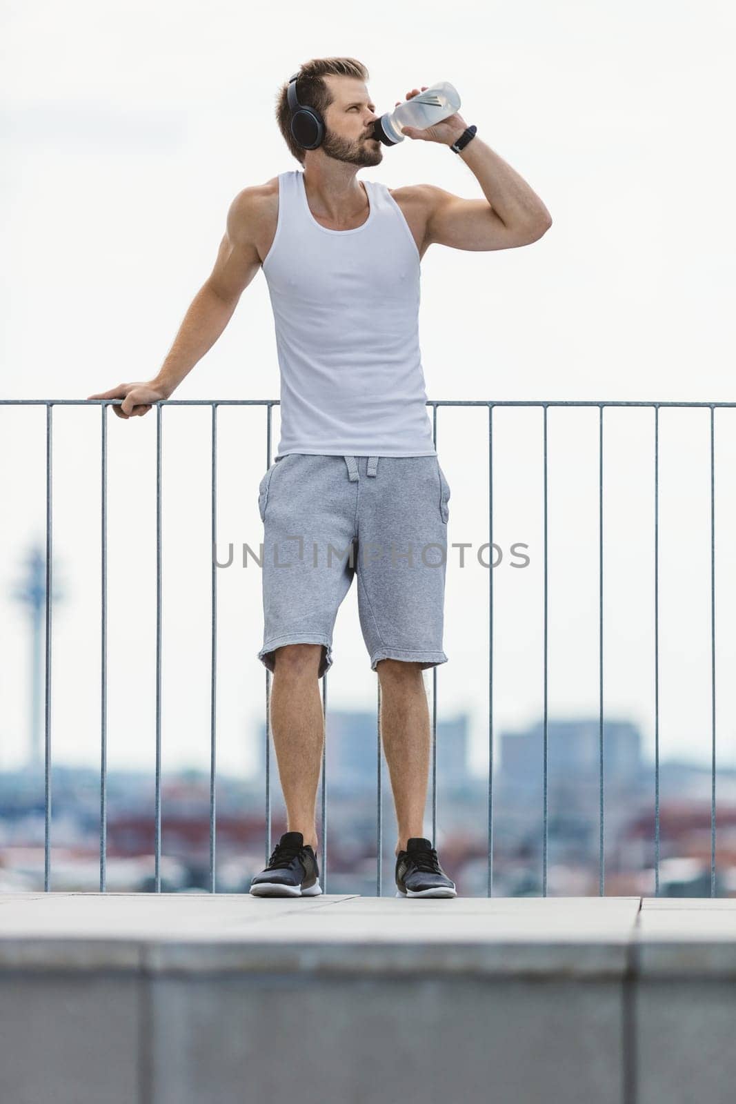 Handsome young man training and working out outdoors