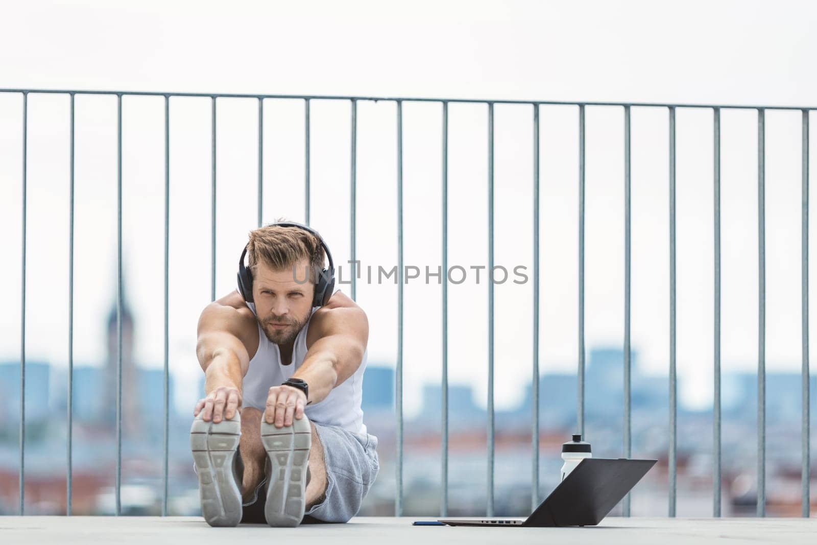 Handsome young man training and working out outdoors