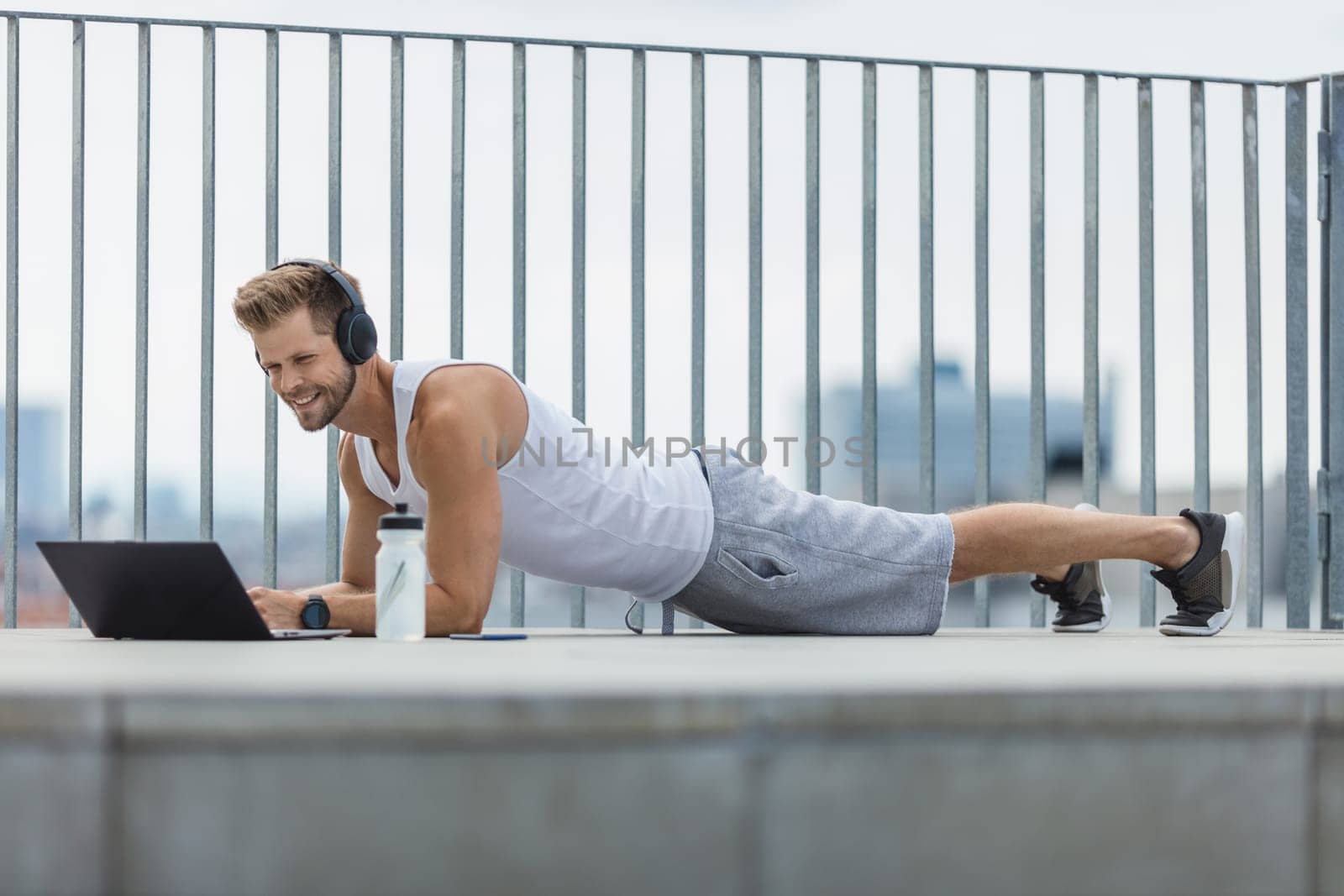 Handsome young man training and working out outdoors