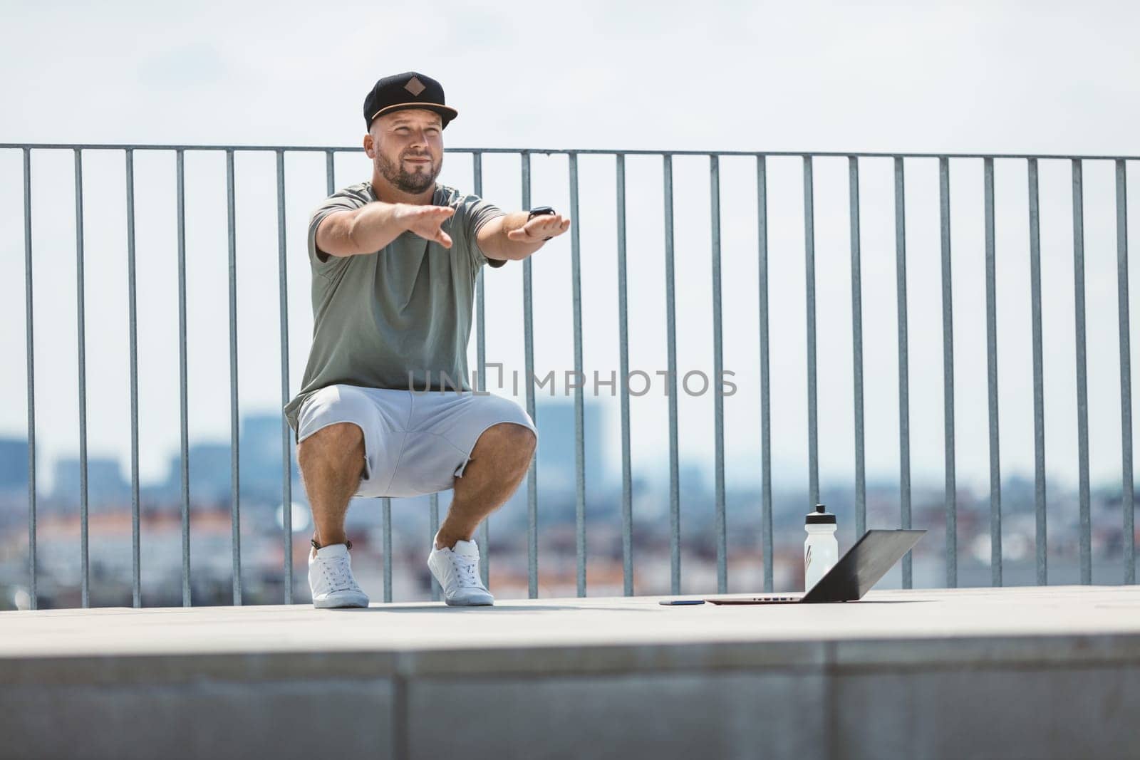 Handsome young man training and working out outdoors