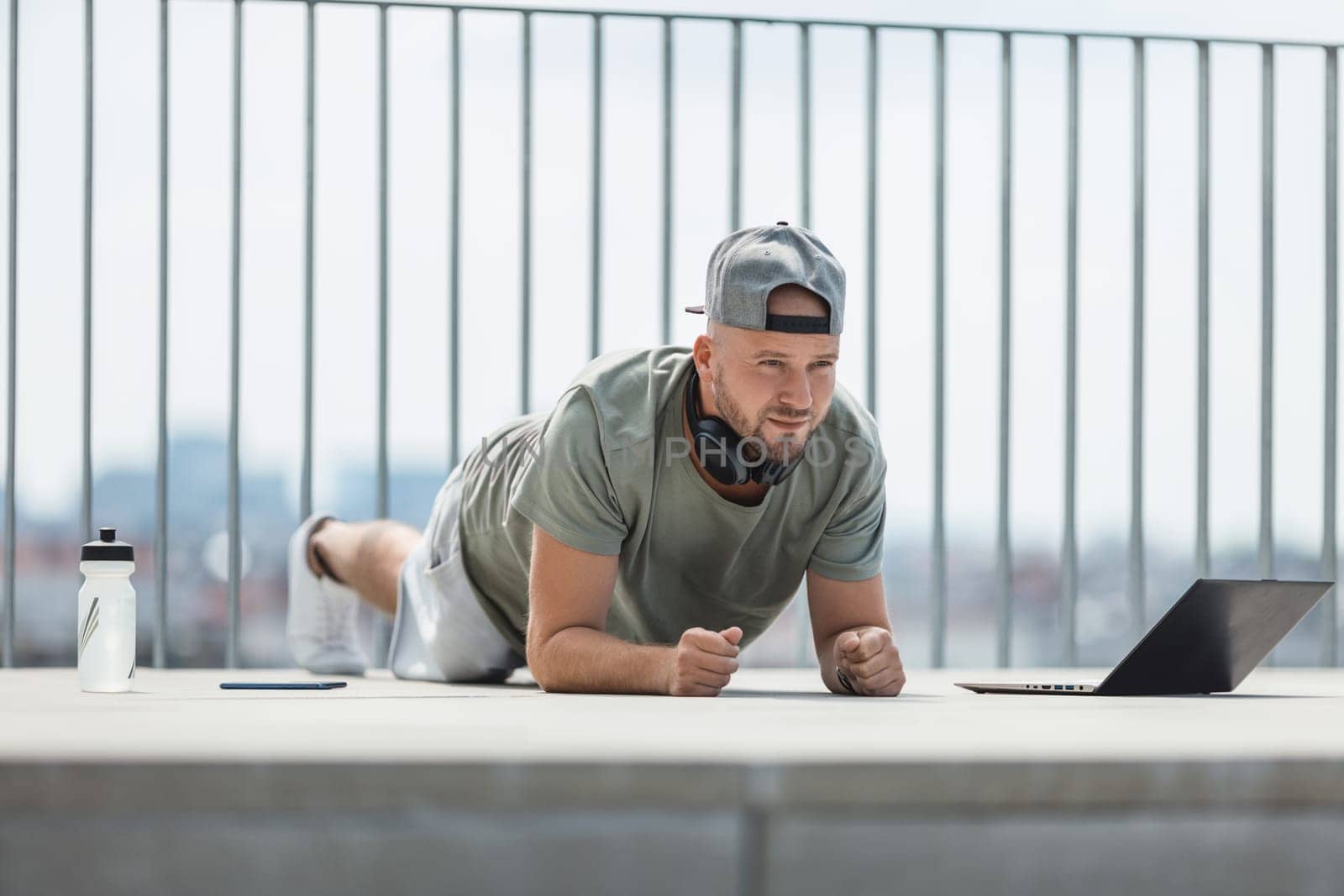 Handsome young man training and working out outdoors