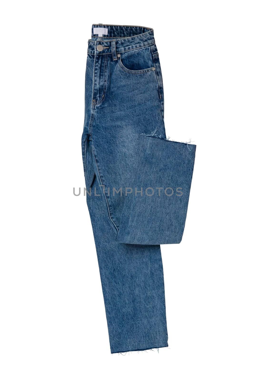 Woman jeans isolated. Folded trendy stylish female blue jeans trousers isolated on a white background. Clipping path. Fashionable denim pants for women.