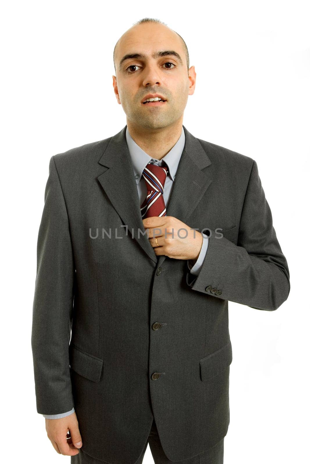 business man adjusting his tie isolated on white