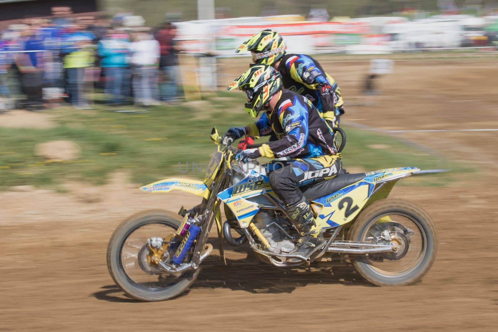 MOHELNICE, CZECH REPUBLIC - APRIL 25. Dynamic shot of two racers in the "International Championship of Czech Republic in sidecarcross 2015"" on April 25. 2015 in Mohelnice, Czech Republic."