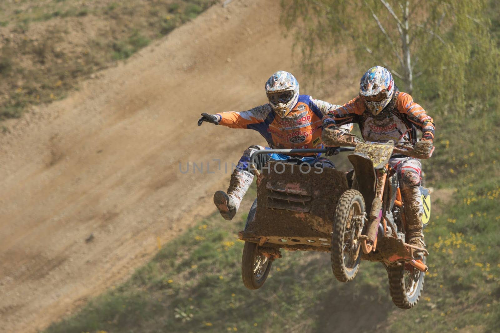 MOHELNICE, CZECH REPUBLIC - APRIL 25.  Gymnastics of racers in jump  in the "International Championship of Czech Republic in sidecarcross 2015"" on April 25. 2015 in Mohelnice."