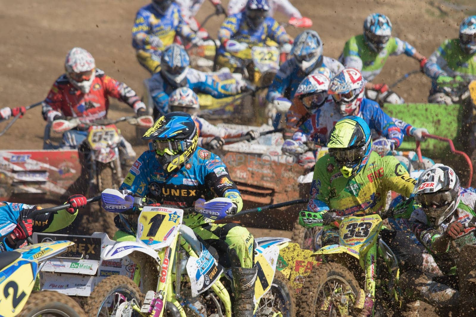 MOHELNICE, CZECH REPUBLIC - APRIL 25. Closeup view of racers after the start of "International Championship of Czech Republic in sidecarcross 2015"" on April 25. 2015 in Mohelnice."