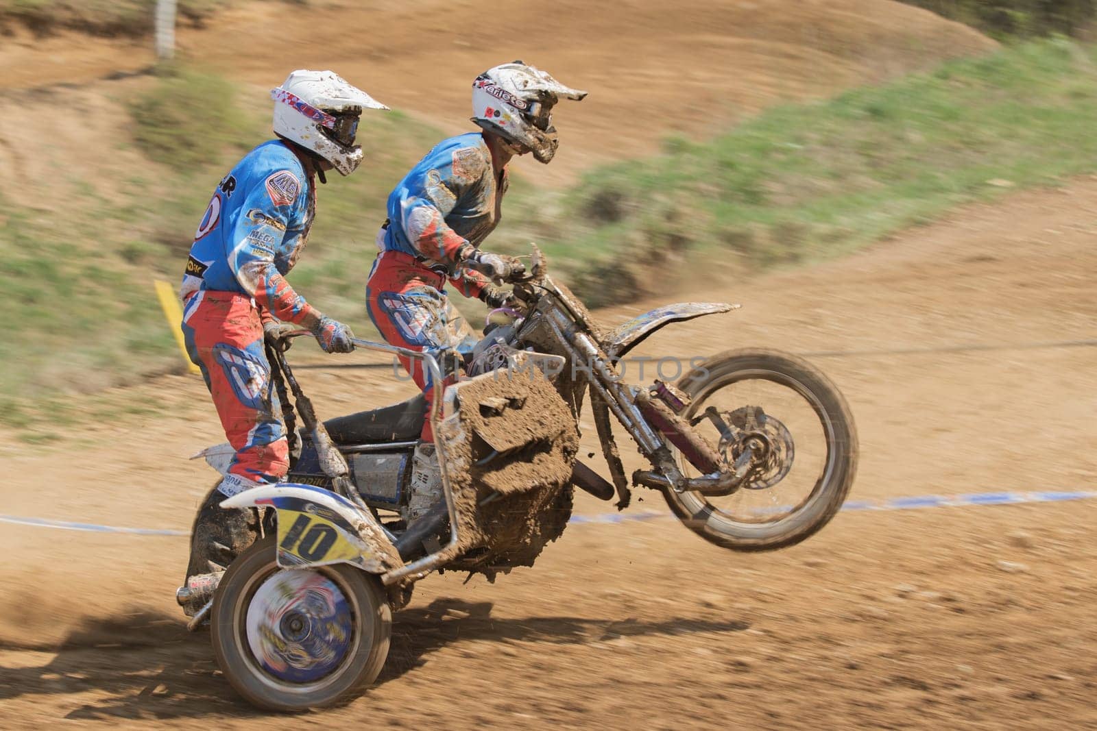 MOHELNICE, CZECH REPUBLIC - APRIL 25. Dynamic shot of racers standing on a sidecar in the "International Championship of Czech Republic in sidecarcross 2015"" on April 25. 2015 in Mohelnice."